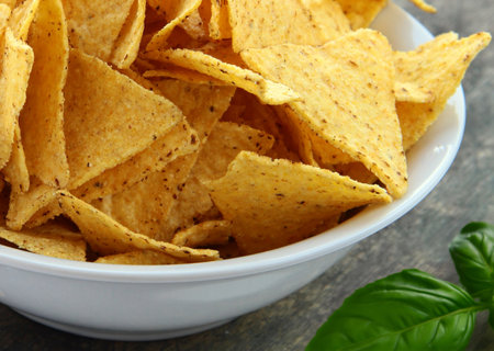 nacho corn chips and guacamole sauceの写真素材