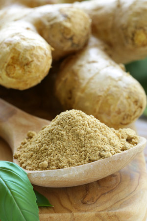 ground and fresh ginger spices for healthy eatingの写真素材