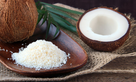 natural coconut and coconut flakes on the tableの写真素材