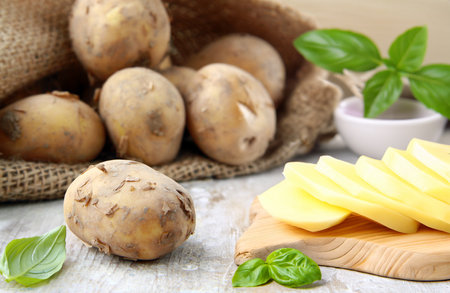 organic farm potatoes on a wooden tableの写真素材