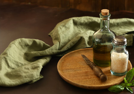 olive oil, basil and salt on the table for backgroundの写真素材