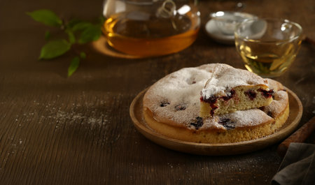 homemade pie with berries and powdered sugarの写真素材