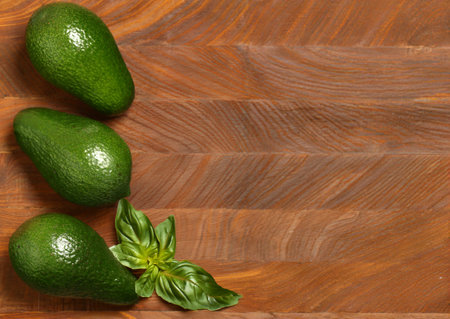 ripe organic avocado for healthy eating on wooden backgroundの写真素材