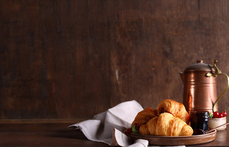 traditional breakfast with croissants and jamの写真素材