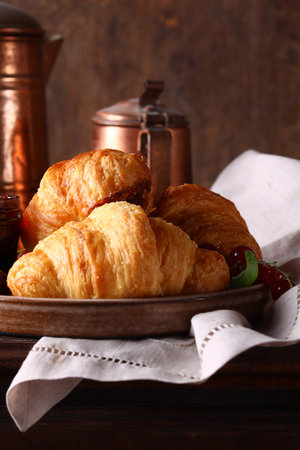 traditional breakfast with croissants and jamの写真素材