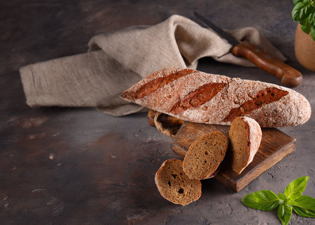 homemade rye bread loaf on a wooden tableの写真素材