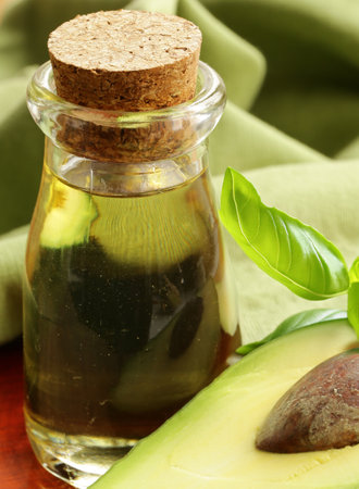 natural organic avocado oil on the tableの写真素材