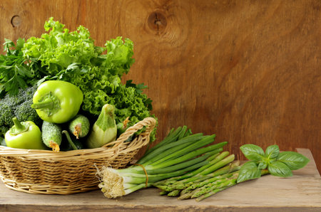 fresh organic green vegetables in basketの写真素材