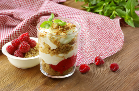 layered dessert in a glass trifle pudding with berriesの写真素材