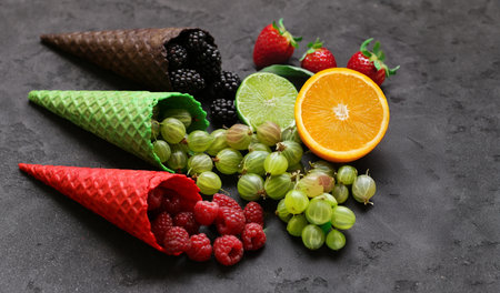 assorted ice cream of different flavors in waffle conesの写真素材