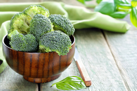 organic broccoli on wooden table healthy eatingの写真素材