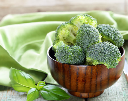organic broccoli on wooden table healthy eatingの写真素材