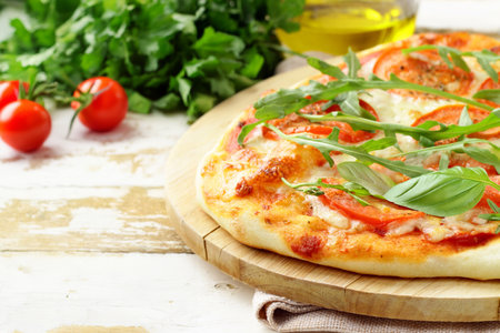 traditional pizza with tomatoes and basilの写真素材