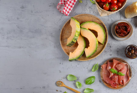 Italian antipasto prosciutto melone melon with hamの写真素材