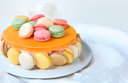 piece of cake dessert with fresh berries and macaroonsの写真素材