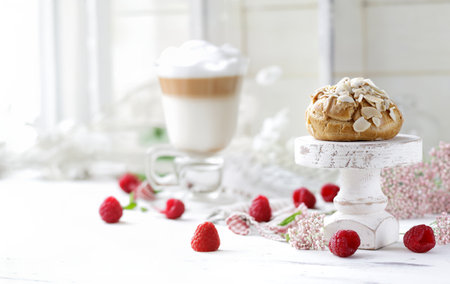 traditional choux pastry eclair dessert on a plateの写真素材