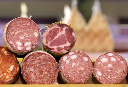 sausage loaf in packaging on a wooden board