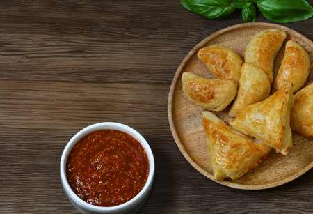 traditional oriental food samsa with sauceの写真素材