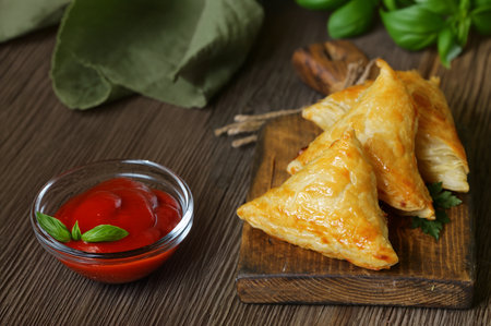traditional oriental food samsa with sauceの写真素材