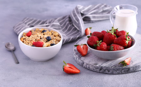 granola with berries for breakfast, healthy eatingの写真素材