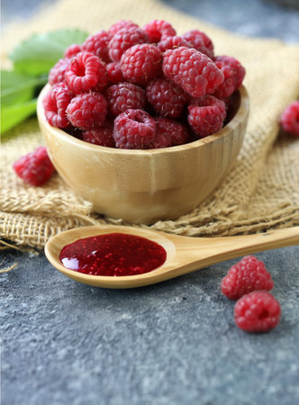 raspberry jam with fresh berriesの写真素材