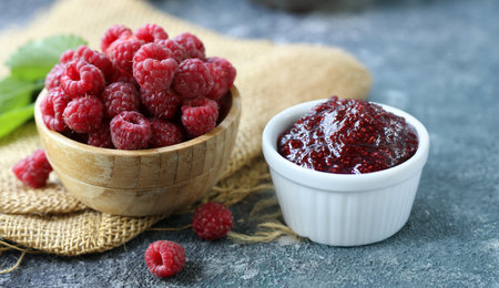 raspberry jam with fresh berriesの写真素材