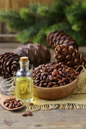 organic pine nut oil on wooden tableの写真素材