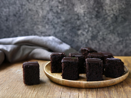 mini brownies with chocolate glaze on a plateの写真素材