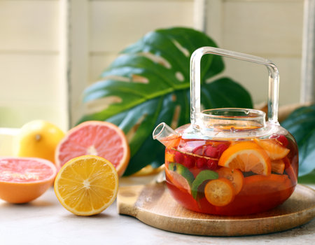 citrus tea with fresh fruits and berriesの写真素材