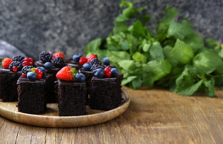 mini brownies with chocolate glaze on a plateの写真素材
