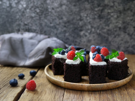 mini brownies with chocolate glaze on a plateの写真素材