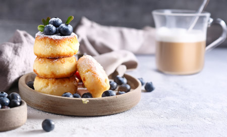 cheese pancakes with fresh berries for breakfastの写真素材