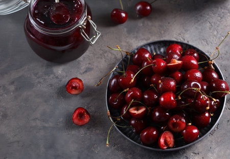 natural organic cherry jam and fresh berriesの写真素材