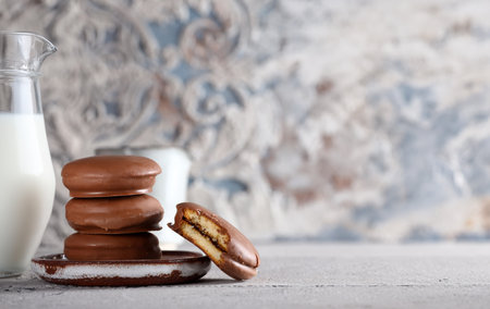 chocolate chip cookies with milk on the tableの写真素材