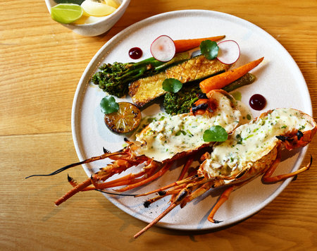 lobster with white sauce on a plateの写真素材