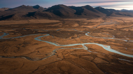 Aerial view of a small river in the middle of the desertの写真素材