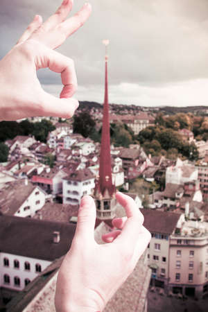 Zurich tower hero in white hand with other hand almost kicking towerの写真素材