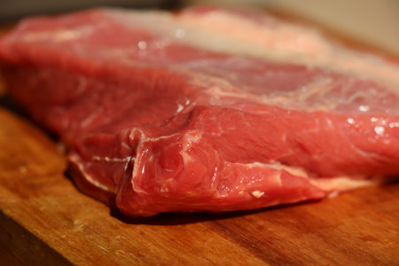 cut of raw beef meat a wood on wooden cutting boardの写真素材