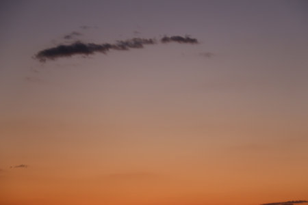 Sunset view of a cloud-streaked skyの写真素材