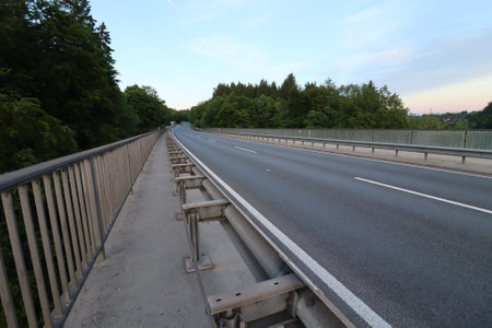 WASSERBURG AM INN, GERMANY - MAY 19, 2025: Empty Innbruecke bridge near Wasserburg with metal...