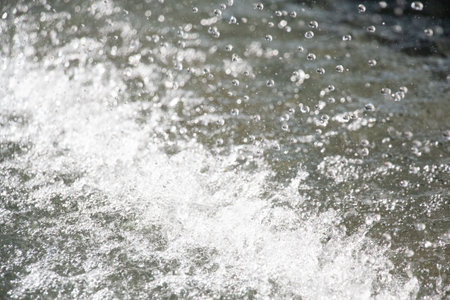 Churning white water with bubbles and foam-abstract nature background