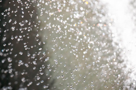 Air bubbles rising in water with sparkling highlights - abstract underwater textureの写真素材