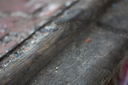 Close up of weathered wooden beam with cracks and dust in Alte Postbahnhof Leipzig - abandoned structure detailの写真素材