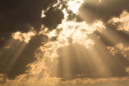 Golden clouds with dramatic sun rays-heavenly sky