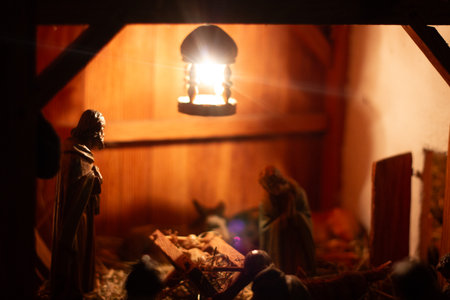 Nativity scene with illuminated stable and figures-Christmas traditionの写真素材