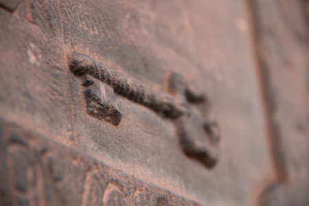 Close-up of a rusted antique latch on an old metal door with shallow depth of fieldの写真素材
