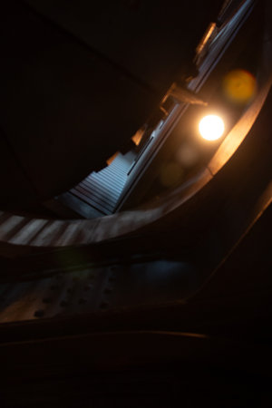 COLOGNE, GERMANY - DECEMBER 29, 2017: Close-up view of interior stair lighting and metal structure inside Cologne Cathedral tower at nightの写真素材