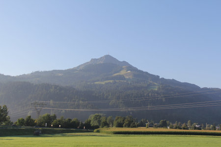 KITZBUEHEL REGION, AUSTRIA - AUGUST 8, 2025: Panoramic view of Kroendlhorn peak across the Pinzgau valley on the way from Wasserburg to Krimmlのeditorial素材