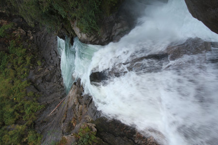 Krimml Waterfalls cascading through forested valley in the High Tauern National Park in Austria
