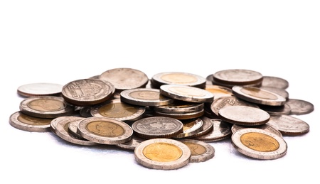 a lot of silver coins on white background